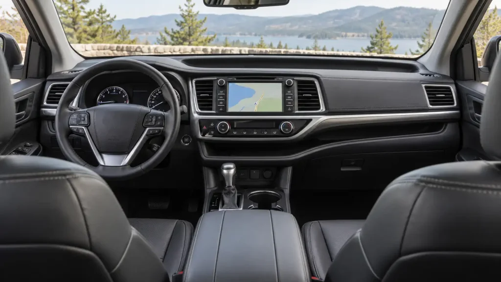 2018 Toyota Highlander XLE dashboard with 8-inch touchscreen and dash-width storage shelf